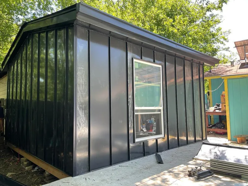 Black standing seam metal wall panels for Metal Roof Installation in Erwin