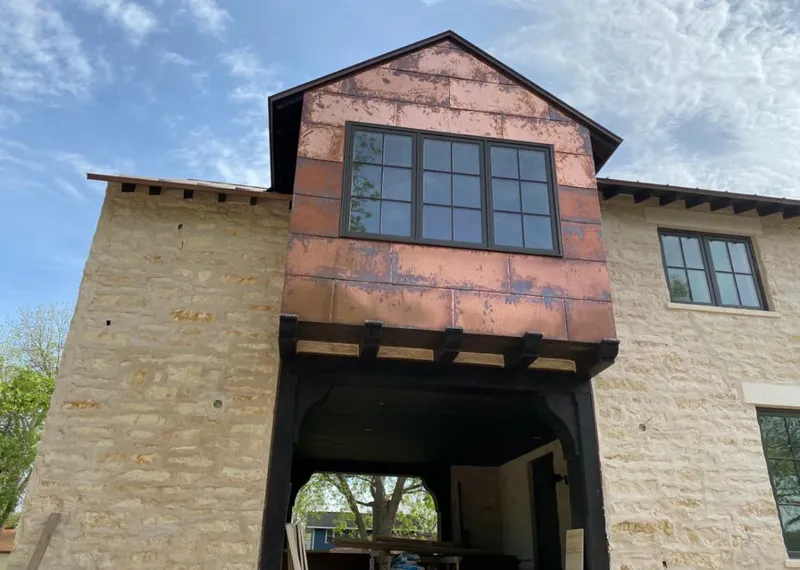 Copper metal panel facade on a stone building for Metal Roof Coating in Erwin